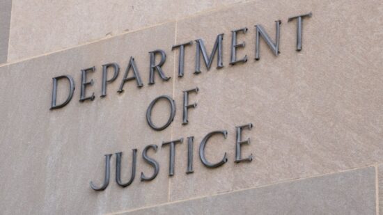 Sign at the United States Department of Justice DOJ in Washington, DC-Shutterstock_2262073553